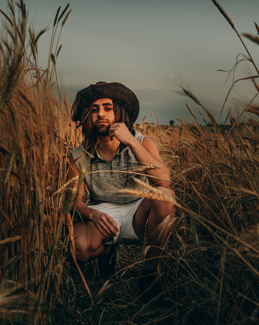 Portrait of a Ukrainian-Canadian farmer standing in a prairie wheat field
