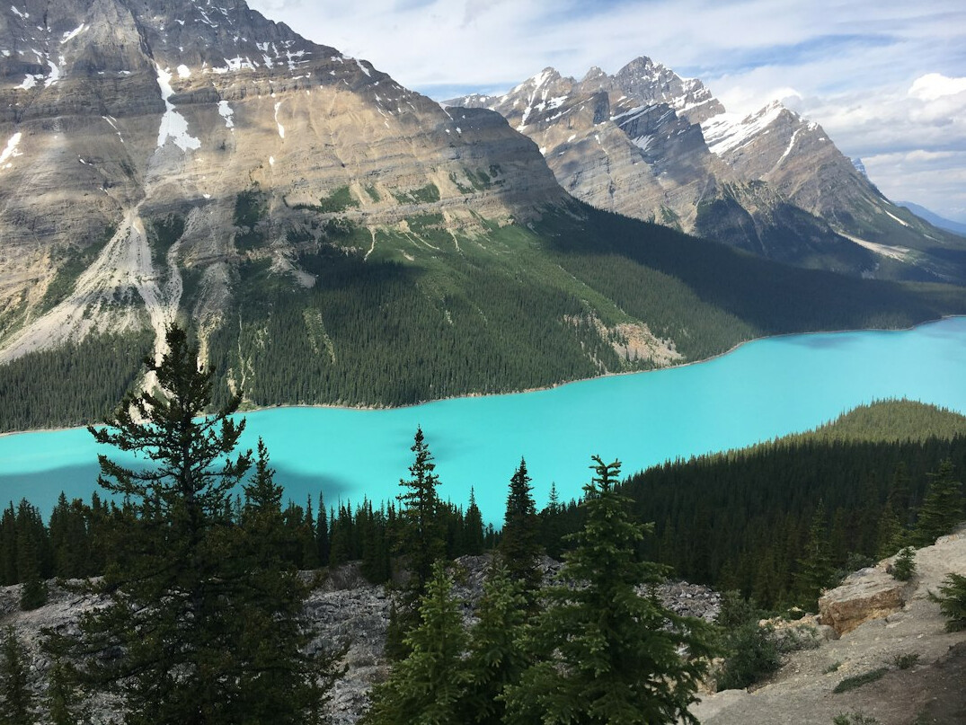 Sweeping view of the Canadian Rocky Mountains with a turquoise glacial lake